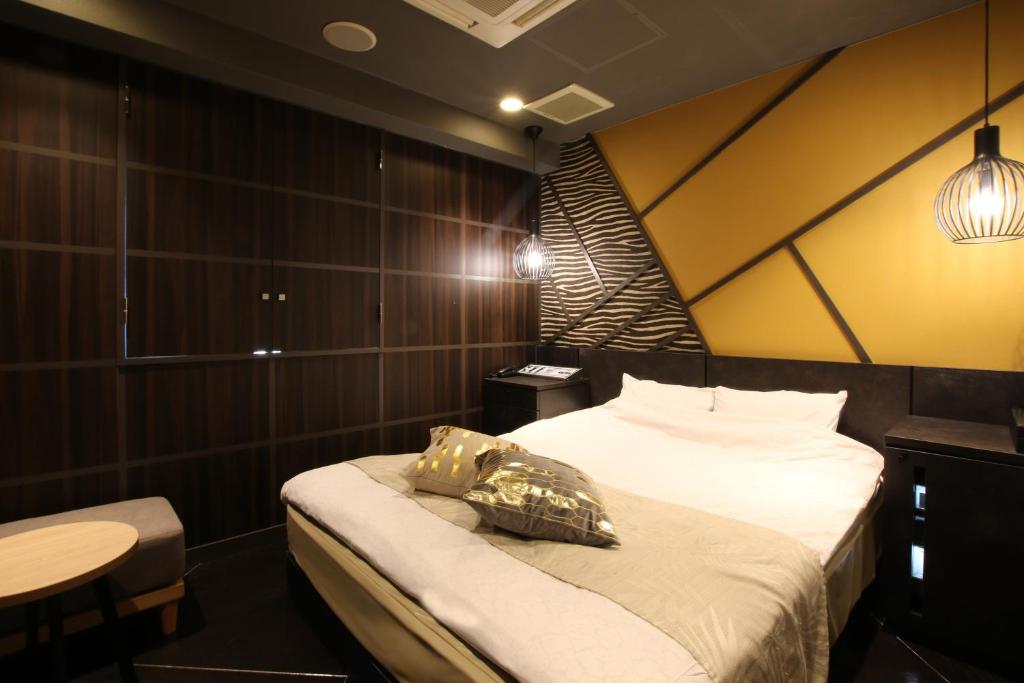 Postel nebo postele na pokoji v ubytování Hotel K Omiya (Adult Only)