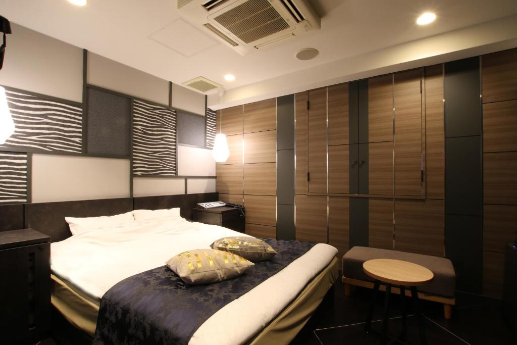 Postel nebo postele na pokoji v ubytování Hotel K Omiya (Adult Only)
