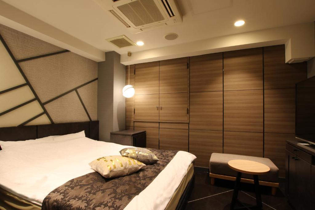 Postel nebo postele na pokoji v ubytování Hotel K Omiya (Adult Only)