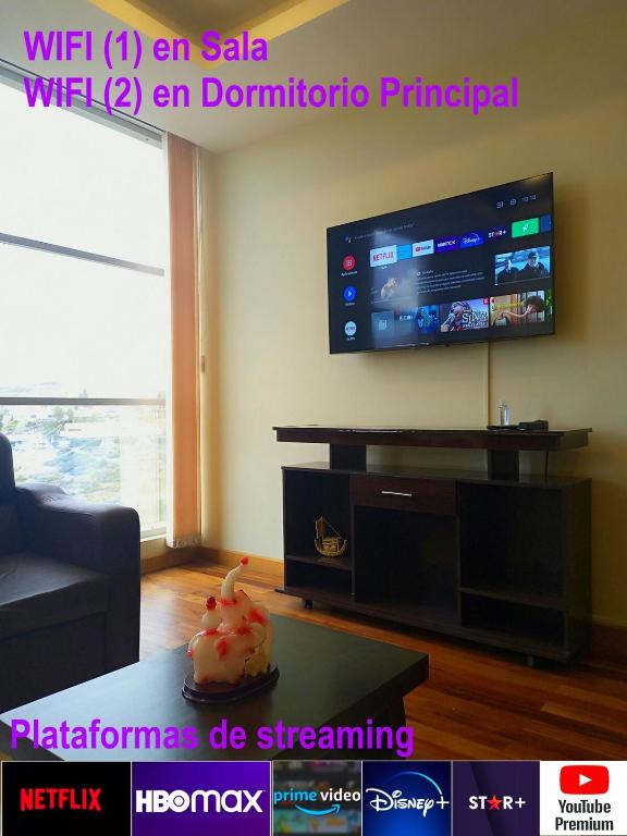 a living room with a flat screen tv on a wall at Apartment in La Paz #07 in La Paz