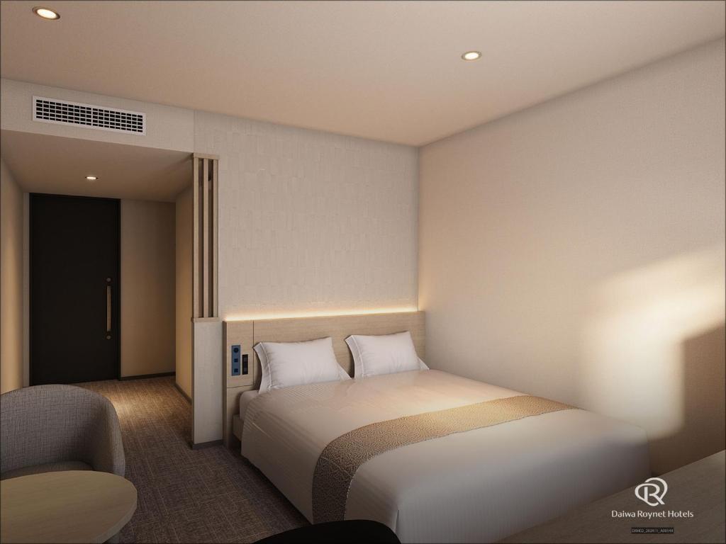 Postel nebo postele na pokoji v ubytování Daiwa Roynet Hotel Mito