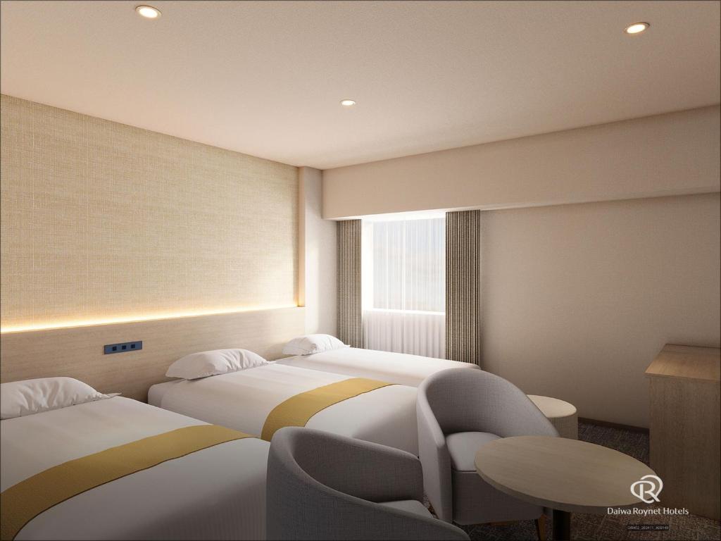 Postel nebo postele na pokoji v ubytování Daiwa Roynet Hotel Mito