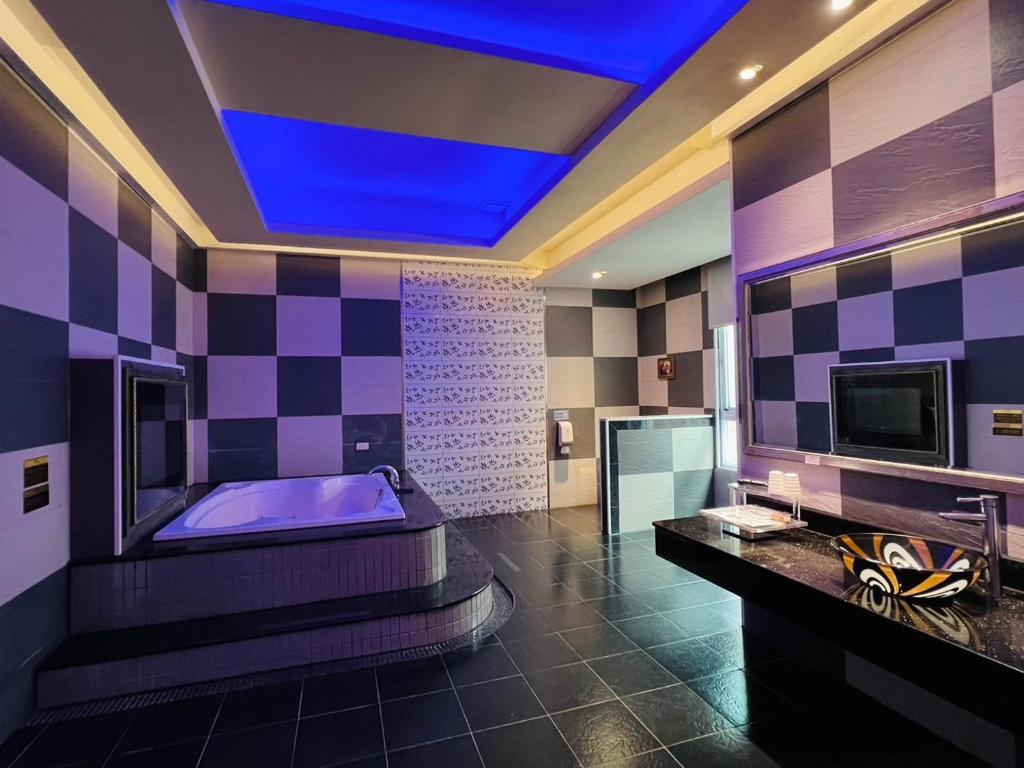 Postel nebo postele na pokoji v ubytování Wei Feng Exquisite Motel Pintung Branch