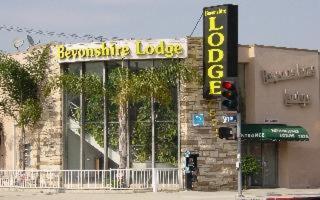 a building with a sign on the side of it at Bevonshire Lodge Motel in Los Angeles