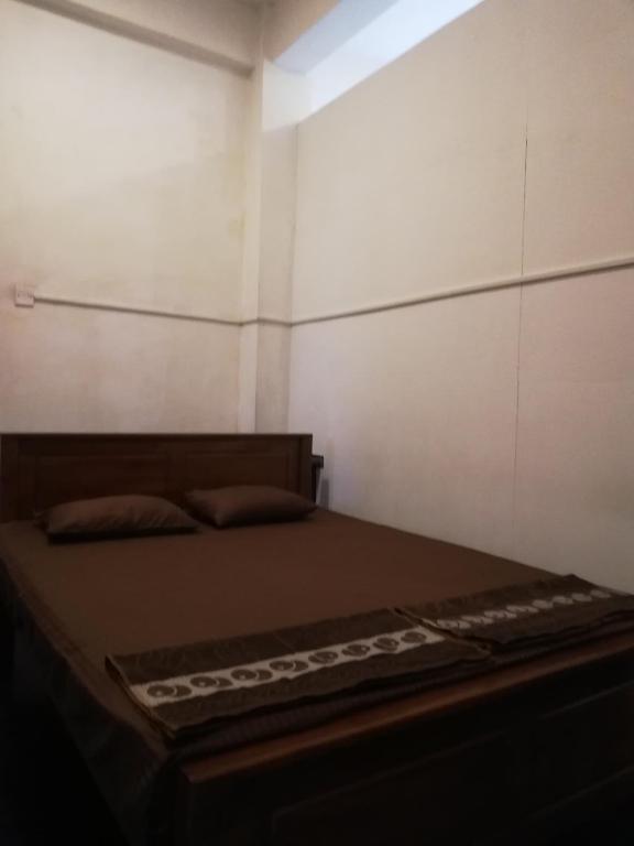 Postel nebo postele na pokoji v ubytování Sesatha Guest
