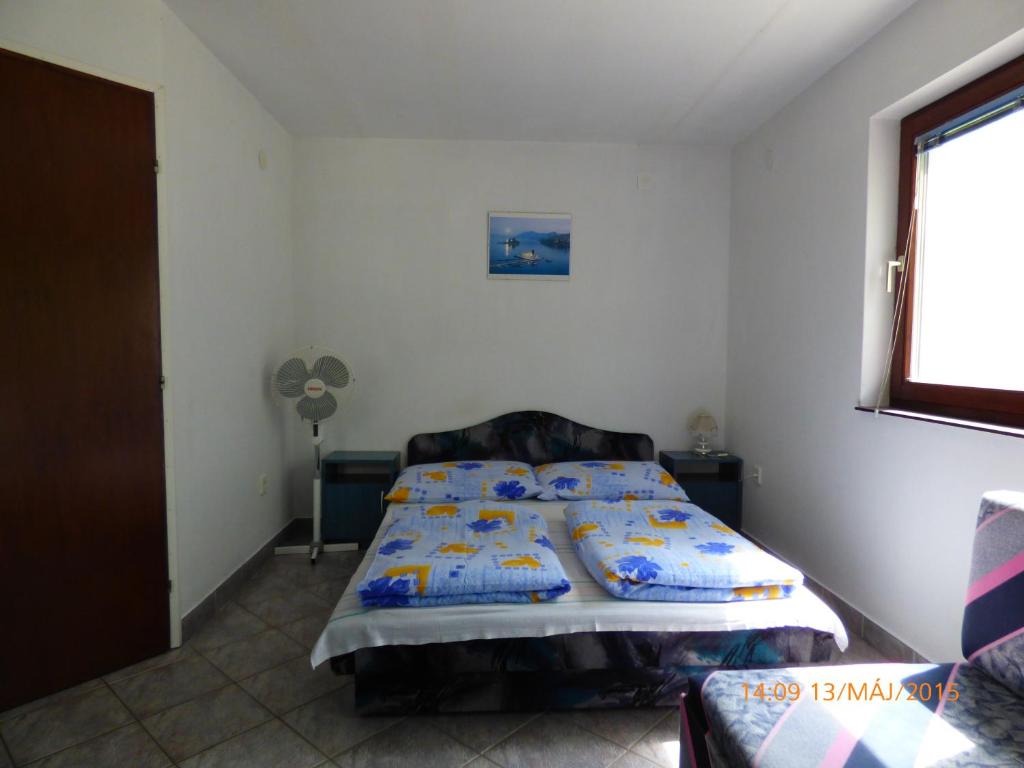 Posteľ alebo postele v izbe v ubytovaní Fábián Apartman-ház