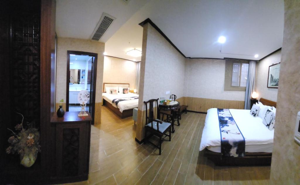 Postel nebo postele na pokoji v ubytování Suzhou Jade Snow Lodge