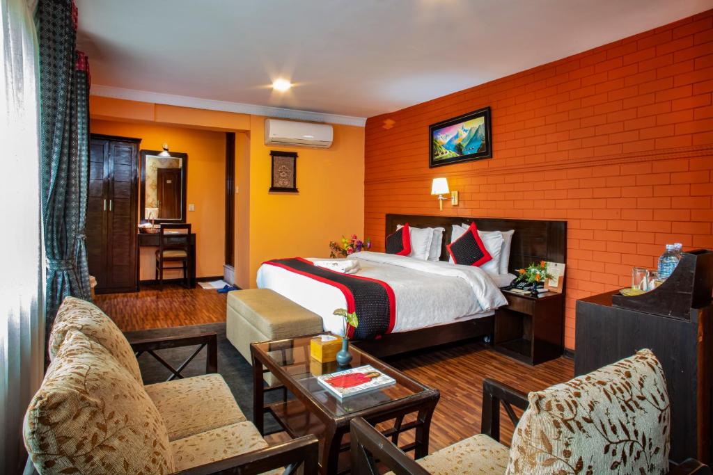 Postel nebo postele na pokoji v ubytování Taleju Boutique Hotel