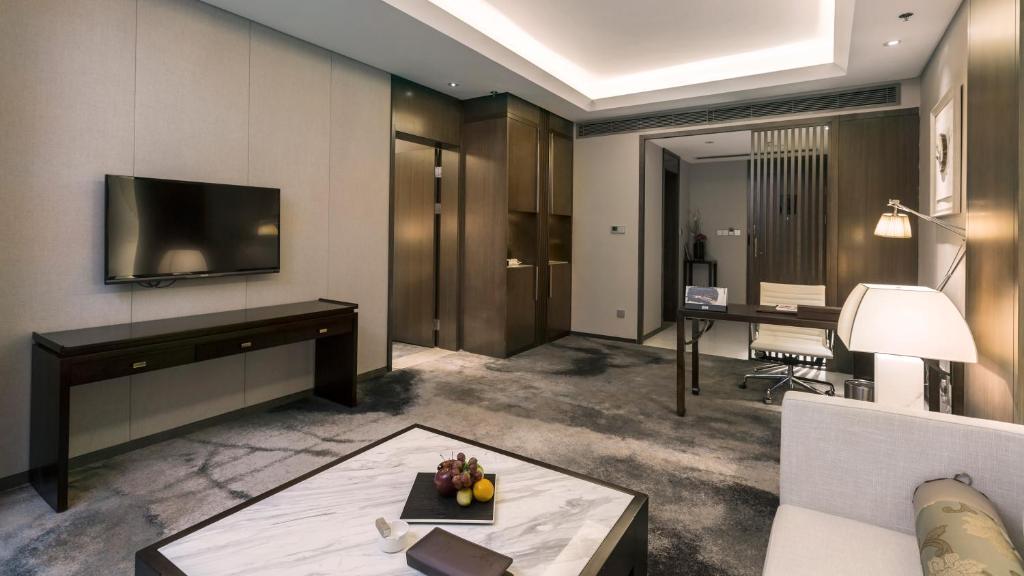 TV a/nebo společenská místnost v ubytování Yun Hotel Wuhan