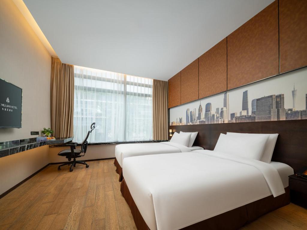 Postel nebo postele na pokoji v ubytování The Mulian Hotel Guangzhou Zhujiang New Town-Canton Fair Free Shuttle Bus