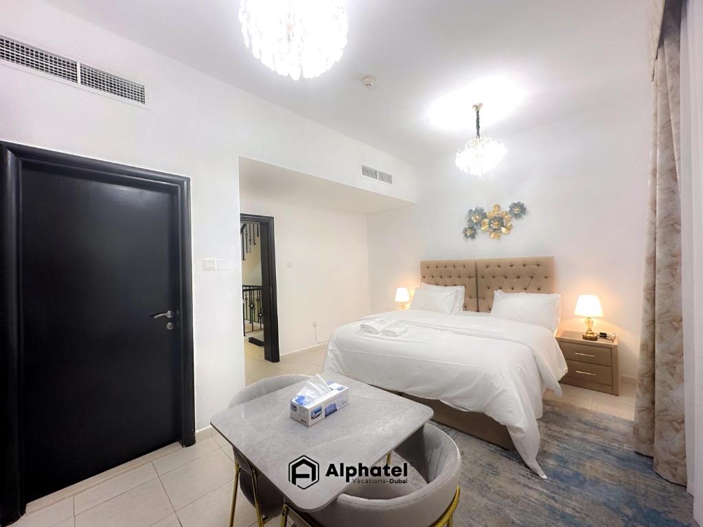Postel nebo postele na pokoji v ubytování Stylish 3-bedroom plus Maid room - Villa in JVC - Dubai