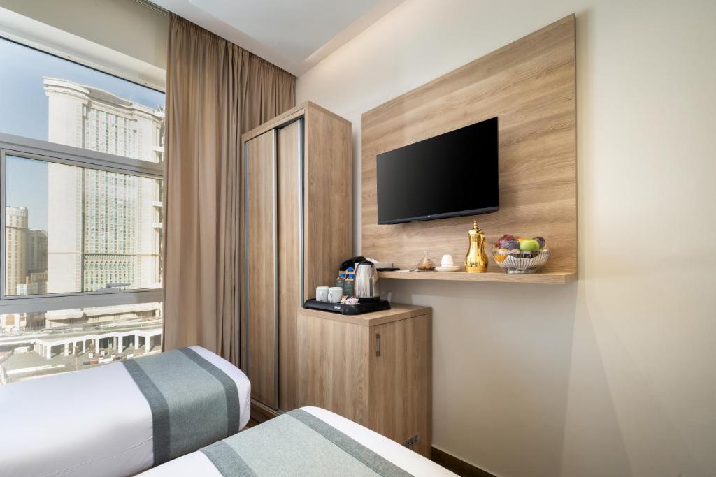 Postel nebo postele na pokoji v ubytování Worth Elite Hotel