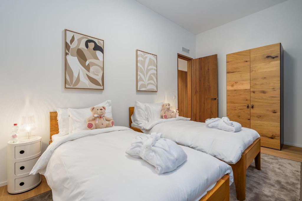 Postel nebo postele na pokoji v ubytování Swiss Hotel Apartments - Engelberg