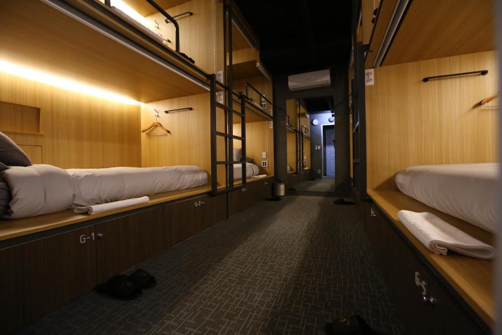a corridor of a train with two bunk beds at Philstay Myeongdong Boutique Female in Seoul