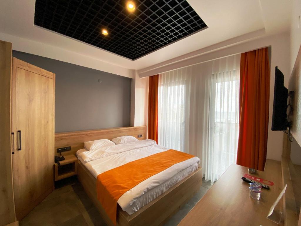 Postel nebo postele na pokoji v ubytování CSK OTEL