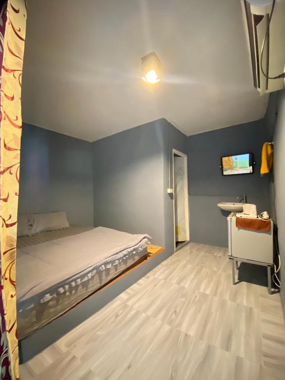 Postel nebo postele na pokoji v ubytování MD Kohlarn-Pattaya