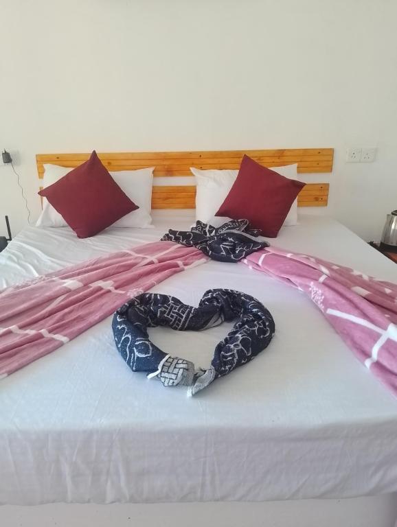 Postel nebo postele na pokoji v ubytování Breeze Climes Ella