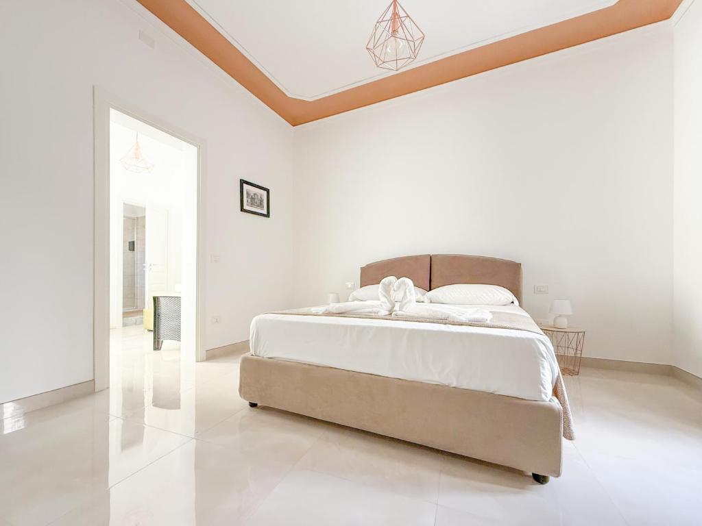 Postel nebo postele na pokoji v ubytování FeVi Rooms