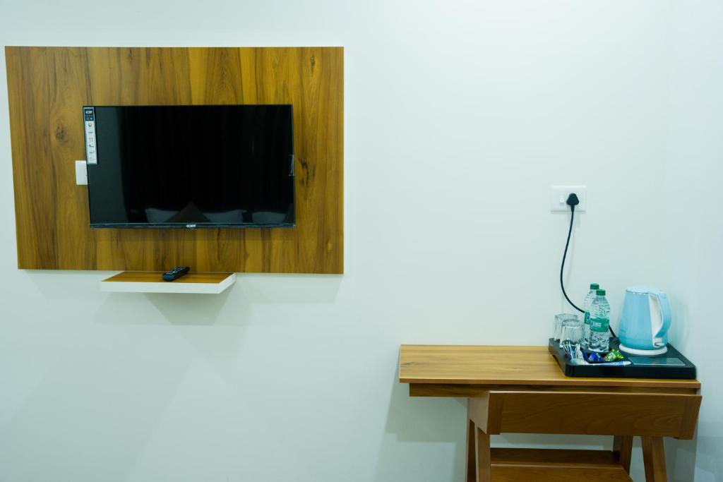 TV a/nebo společenská místnost v ubytování FLY VIEW Airport Residency