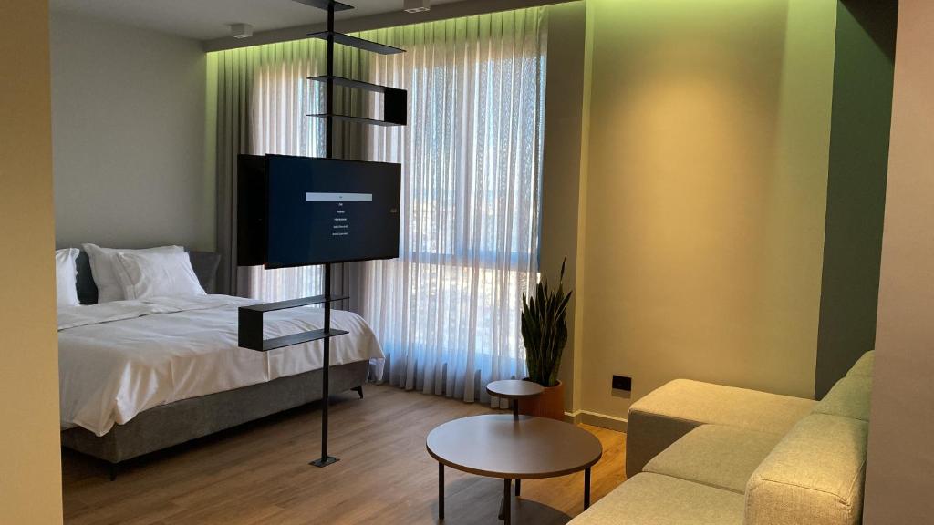 Postel nebo postele na pokoji v ubytování Si Hotel Tirana