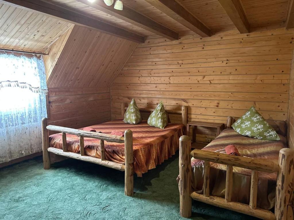 Postel nebo postele na pokoji v ubytování Хата Магната та Смерекова Хата
