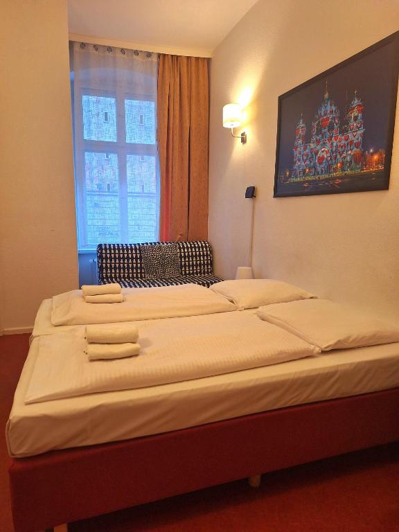 Postel nebo postele na pokoji v ubytování Hotel Amelie Berlin