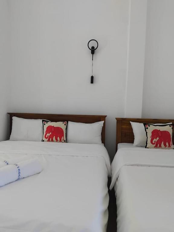 Postel nebo postele na pokoji v ubytování White Lodge
