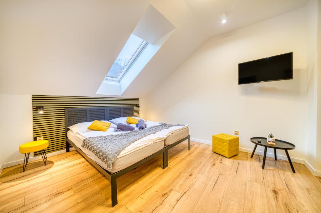 Postel nebo postele na pokoji v ubytování HM Apartments