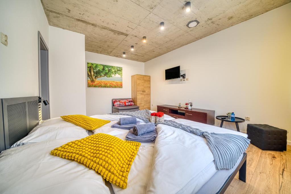 Postel nebo postele na pokoji v ubytování HM Apartments