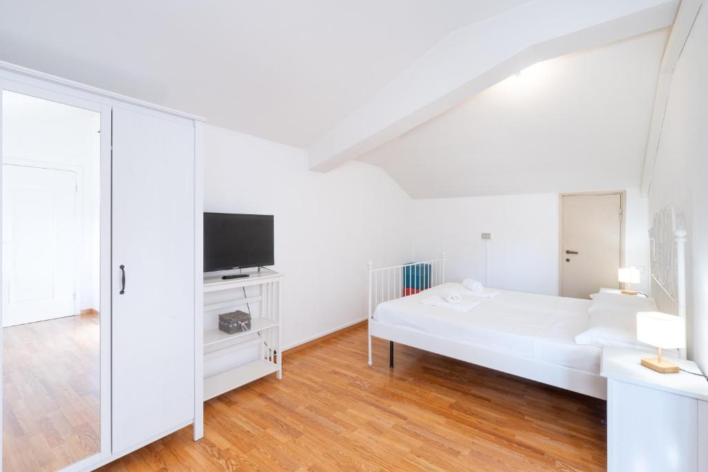 Postel nebo postele na pokoji v ubytování Cittadella Suite
