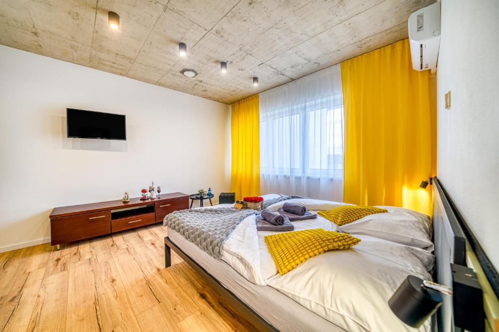 Postel nebo postele na pokoji v ubytování HM Apartments