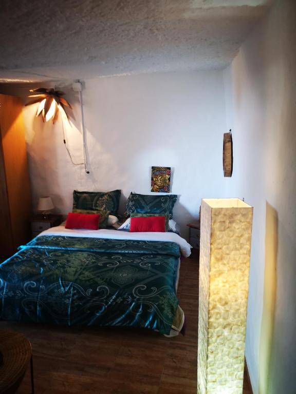 Postel nebo postele na pokoji v ubytování Suite Zen y Cueva Refugio