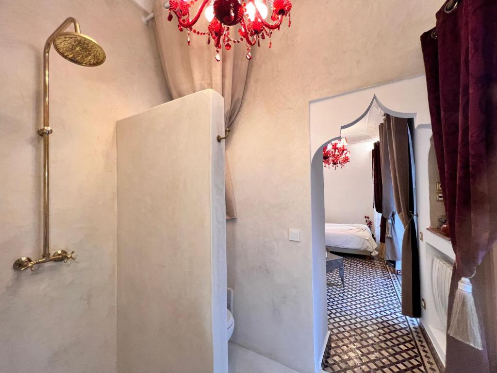Postel nebo postele na pokoji v ubytování Riad Asrari