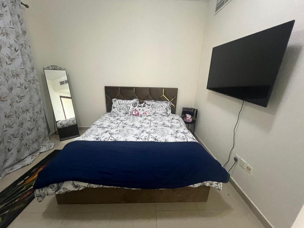 Postel nebo postele na pokoji v ubytování SHJ DXB Sunny Border