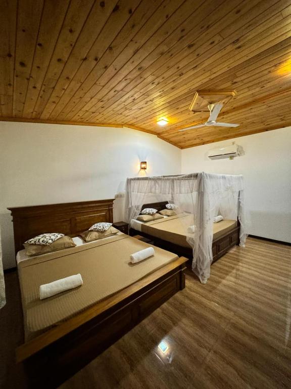 Postel nebo postele na pokoji v ubytování Shan Star Weligama
