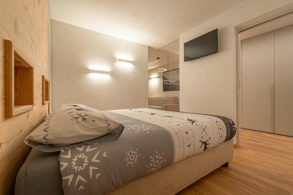 Postel nebo postele na pokoji v ubytování Appartamenti Ai Due Campanili
