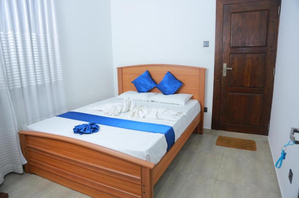 Ένα ή περισσότερα κρεβάτια σε δωμάτιο στο Estro Guest House