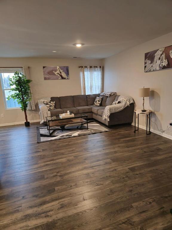 a living room with a couch and a table at Elizabethtown Charm in Elizabethtown
