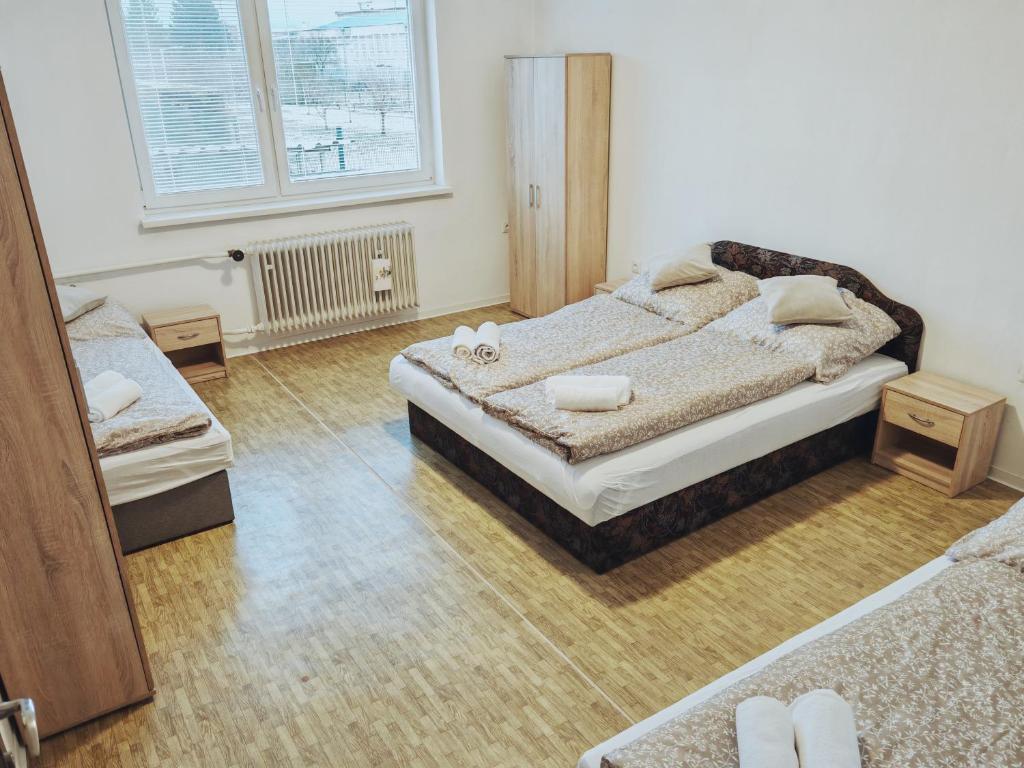 Postel nebo postele na pokoji v ubytování LUMA ubytovanie