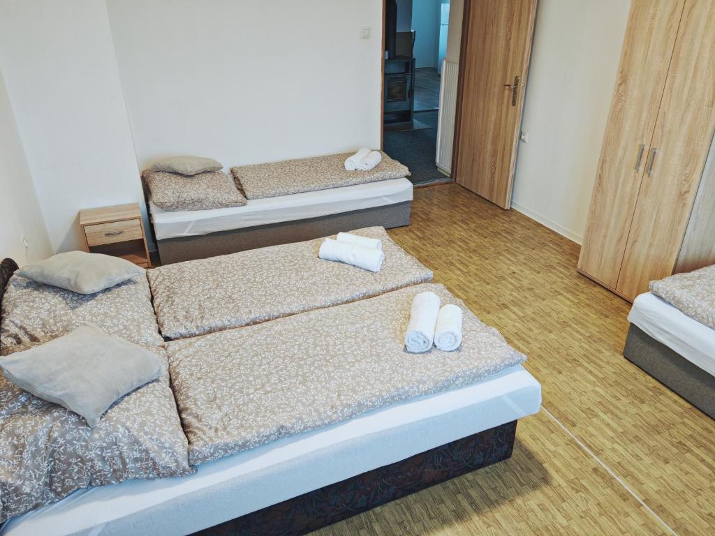 Postel nebo postele na pokoji v ubytování LUMA ubytovanie