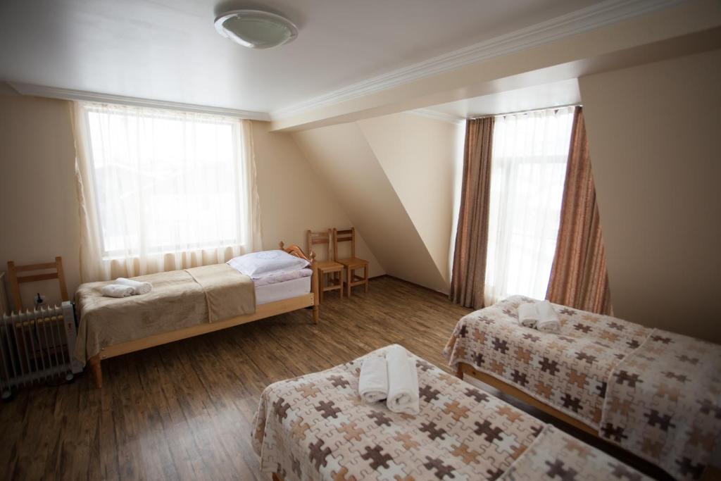 Postel nebo postele na pokoji v ubytování Mestiatour Guest House