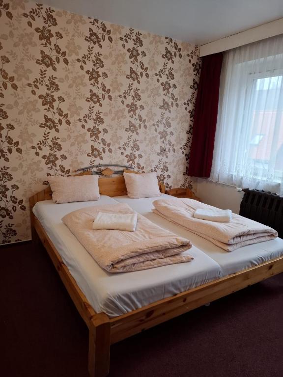 Postel nebo postele na pokoji v ubytování Ferienheim Sorgenfrei