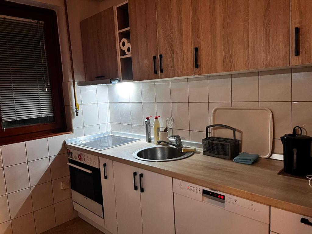 a kitchen with a sink and a counter top at Comfort&Peace in Sarajevo