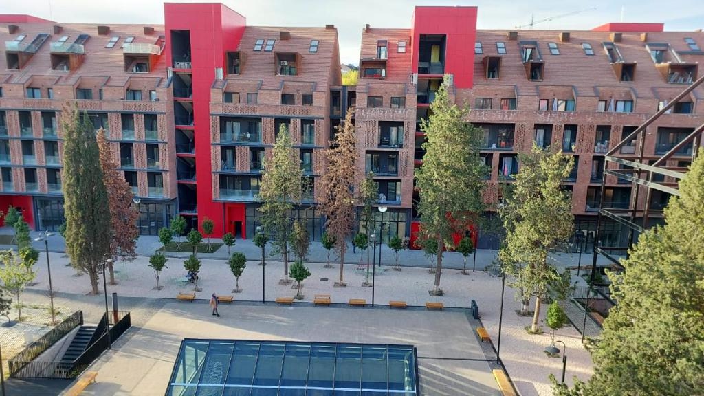 an empty courtyard in a city with tall buildings at Rooftop apt Avlabari with with open view #3 in Tbilisi City