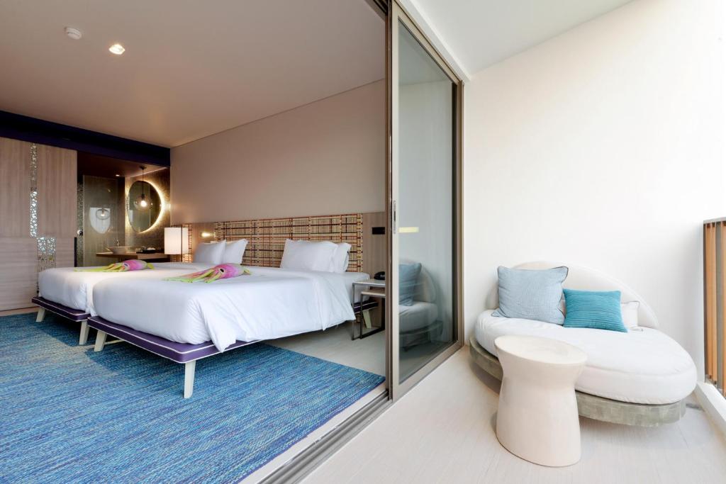 Postel nebo postele na pokoji v ubytování Veranda Resort Pattaya - MGallery Collection