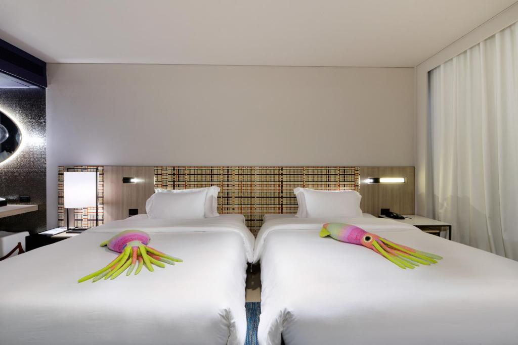 Postel nebo postele na pokoji v ubytování Veranda Resort Pattaya - MGallery Collection