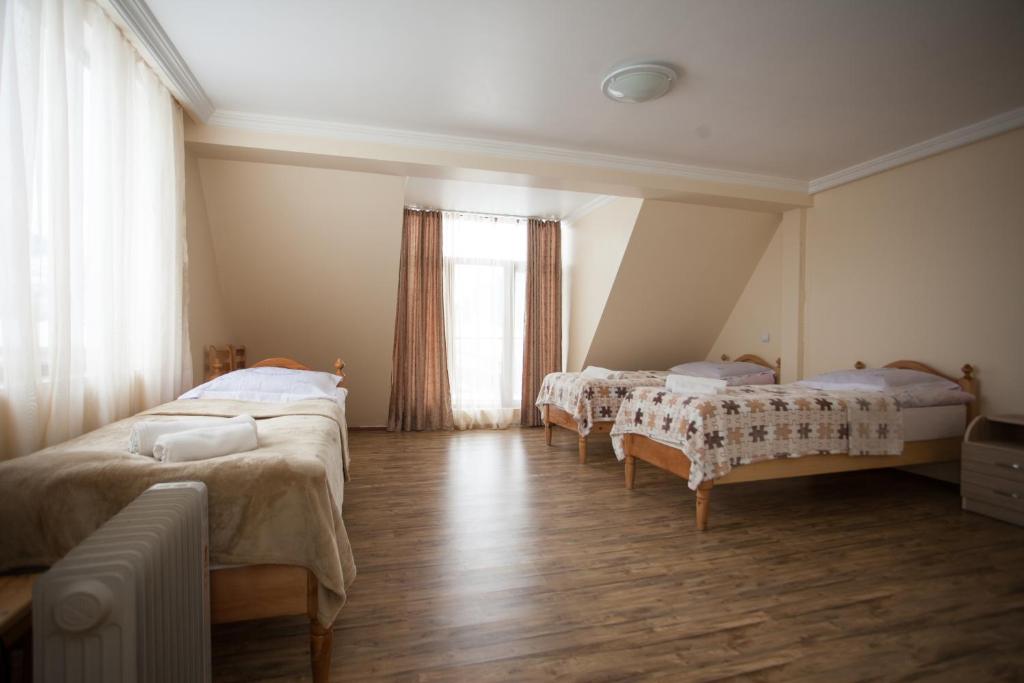 Postel nebo postele na pokoji v ubytování Mestiatour Guest House