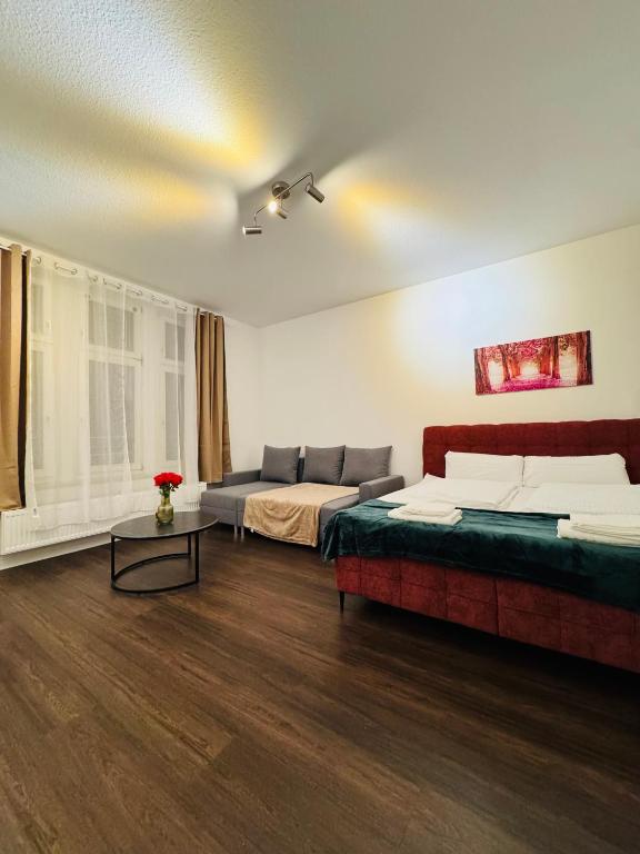 a living room with two beds and a couch at Charmante Auszeit im Harz in Blankenburg