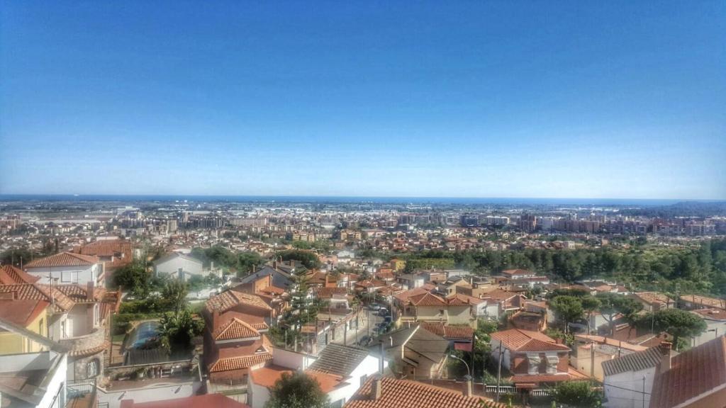 an aerial view of a city with houses at Apartamento con vistas al mar in Viladecáns