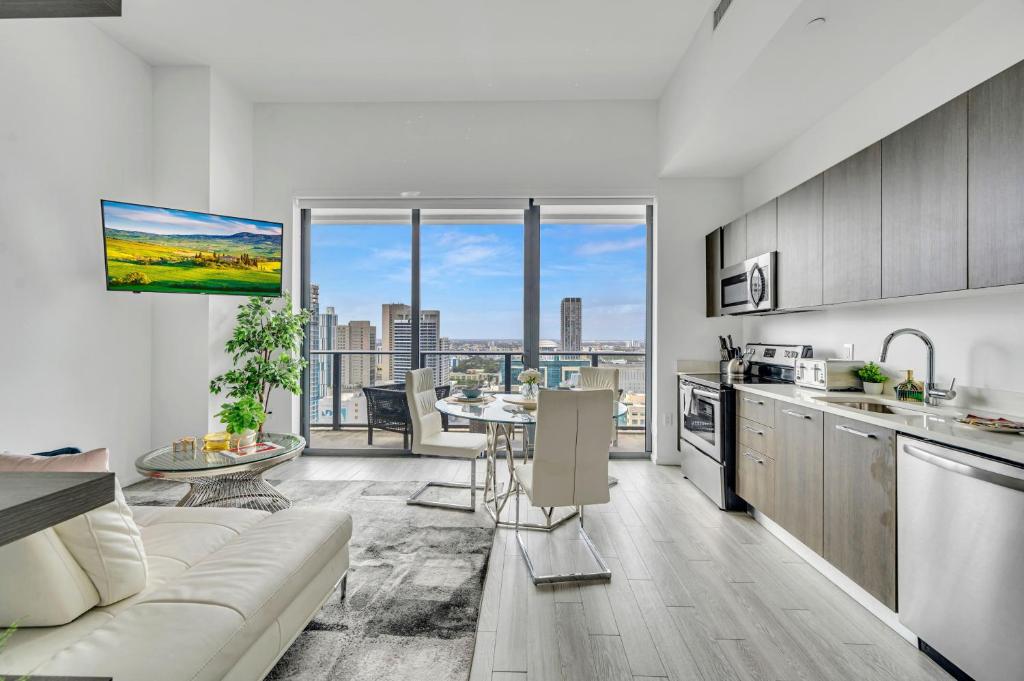 a kitchen and living room with a view of a city at City Views Studio Downtown Miami in Miami